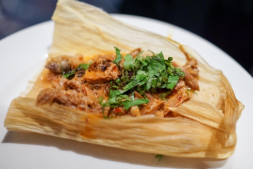 Rostizado x Tangle Ridge Ranch - Tamales de Barbacoa y Queso (steamed corn-ricotta cake wrapped in its husk served with lamb braised with chiles, spices, tomatoes, and fresh herbs)